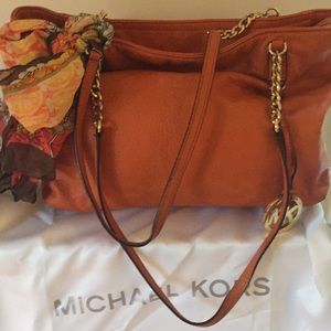 Michael Kors orange handbag with cute scarf